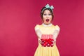 Happy surprised young woman giving you a gift box Royalty Free Stock Photo