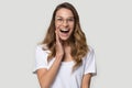 Happy surprised young woman wearing glasses with open mouth Royalty Free Stock Photo