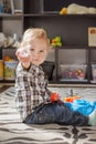 Happy sweet baby boy having fun playing with colorful toys, at home Royalty Free Stock Photo