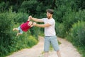 Happy and sweet moments of a summer walk in the park of a father and a little son