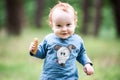 Happy sweet toddler in forest