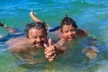 Happy swimmers dad and son in the sea