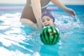 Happy swimming with ball kid