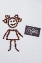 Happy symbolic girl made of coffee beans.