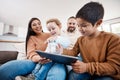 Happy, tablet and bonding with family on sofa for search, streaming and fun games. Technology, internet and connection Royalty Free Stock Photo