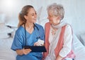 Happy, tablet and nurse consulting an old woman with medical report results or doctor healthcare diagnosis. Smile, bed