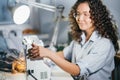 Happy tailor making pattened stitches on sewing machine in studio