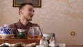 Happy tea master talking with interlocutor during tea ceremony