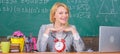 Always happy. teacher with alarm clock at blackboard. Time. woman in classroom. Back to school. Teachers day. Study and Royalty Free Stock Photo