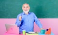 Happy teacher. school lesson break. Mature teacher man with coffee cup. tutor in classroom. Making notes. senior man Royalty Free Stock Photo