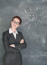 Happy teacher and smiling sun on the chalkboard Royalty Free Stock Photo