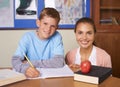 Happy teacher, student and portrait in support for education, learning or tutor in classroom at school. Woman, mentor or