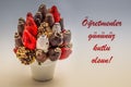 Happy teachers day greeting card that reads Ogretmenler gununuz kutlu olsun with red lettering; A bundle of edible flowers,