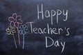 Happy Teachers Day written in chalkboard with white chalk Royalty Free Stock Photo