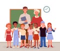 Happy teachers and students children standing in classroom and smiling, back to school Royalty Free Stock Photo