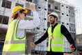 Happy team of architect or engineer with success and glad at construction site, team contractor or worker or partner glad with Royalty Free Stock Photo