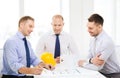 Happy team of architects and designers in office
