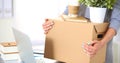 Happy team of businesspeople moving office, packing boxes, smiling Royalty Free Stock Photo