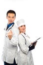 Happy team of two physicians standing back to back with arms fol Royalty Free Stock Photo