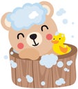 Happy teddy bear taking a bath in wooden tub Royalty Free Stock Photo
