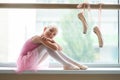 Happy teen ballet girl sitting on windowsill. Royalty Free Stock Photo