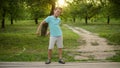 Happy teen boy dancing outside. Smiling guy making rhythmical movements outdoors Royalty Free Stock Photo