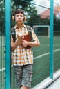 Happy teen boy portrait on the way to school, he is eating an apple, education and back to school concept Royalty Free Stock Photo