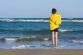 Happy teen boy in the swim flippers having fun on the sand ÃÂ¾n the beach Royalty Free Stock Photo