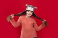 happy teen child wear sweater and earflap hat in studio. winter fashion for teen child.