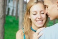 Happy teen girl with a boy at the park