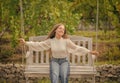 happy teen girl having free time outside on swing, summer Royalty Free Stock Photo