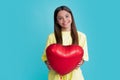 Happy teen girl hold red heart party balloon for valentines day, love symbol, be my valentine. Happy kids face, positive Royalty Free Stock Photo