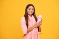 happy teen girl in home terry bathrobe with thermos bottle, morning Royalty Free Stock Photo