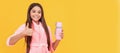 happy teen girl in home terry bathrobe with thermos bottle show thumb up gesture, perfect. Horizontal poster of isolated Royalty Free Stock Photo