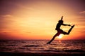 Happy teen girl jumping on the beach Royalty Free Stock Photo