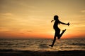 Happy teen girl jumping on the beach Royalty Free Stock Photo