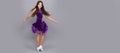 happy teen girl junior ballroom dancer. child in purple dance dress. dancing school. Child face, horizontal poster Royalty Free Stock Photo