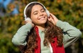 happy teen girl listening music wearing headphones. photo of teen girl listening music. Royalty Free Stock Photo