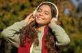 happy teen girl listening music wearing headphones. photo of teen girl listening music. Royalty Free Stock Photo