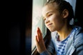 Happy teen girl look out of window outside. recovered. Royalty Free Stock Photo