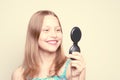 Happy teen girl looking at the mirror Royalty Free Stock Photo