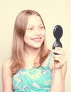 Happy teen girl looking at the mirror Royalty Free Stock Photo