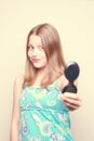 Happy teen girl looking at the mirror Royalty Free Stock Photo