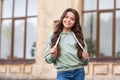 Happy teen girl model posing in casual trendy style blurry outdoors, fashion Royalty Free Stock Photo