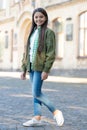 Happy teen girl model posing in casual trendy style outdoors, fashion Royalty Free Stock Photo