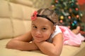 Happy teen girl near decorated Christmas tree Royalty Free Stock Photo