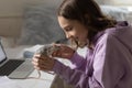 Happy teen girl playing with domesticated rat pet at home Royalty Free Stock Photo