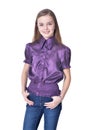 Happy teen girl in purple blouse posing