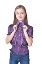 Happy teen girl in purple blouse posing isolated on white background