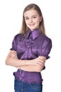 Happy teen girl in purple blouse posing on white background